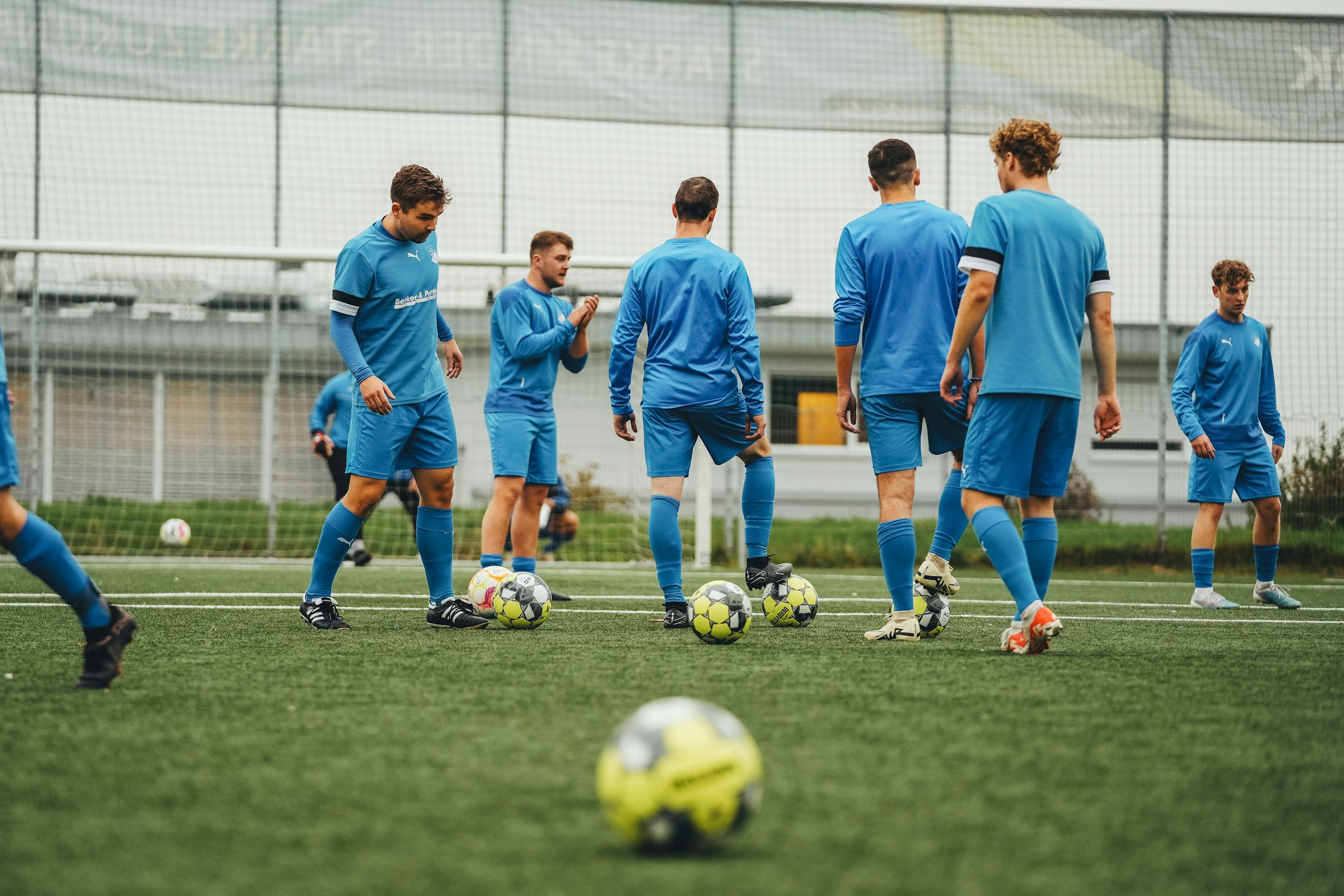 Football coach training players